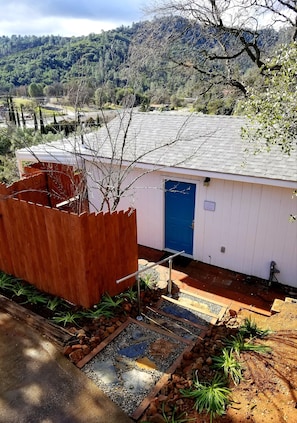 Front walkway with 4 garden steps to front door (keyless entry).
