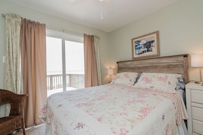 The master bedroom has plenty of room with a cozy king size bed