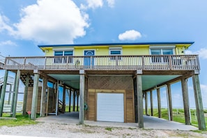 Beautiful 1st row waterfront home with astonishing beach views, outdoor shower, hot tub and custom outdoor bar area