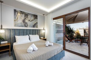Bedroom with a king size bed, a 32TV, and ensuite bathroom