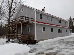 Back decks with private entrance to the apartment on the second floor.