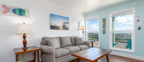 Newly updated living space with comfy furniture and lovely views