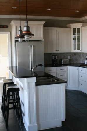 Kitchen island area with saddle seating