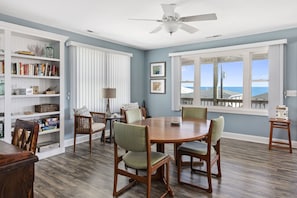 Game table area with view of ocean - expands for 8 people to comfortably play.