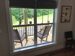 Rocking chairs on porch from kitchen window