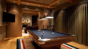 Recreation room with pool table and TV