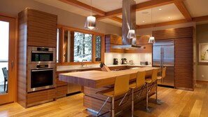 Contemporary gourmet kitchen with stainless steel appliances