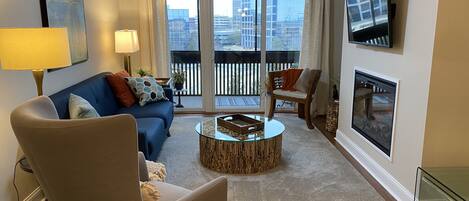 looking from kitchen across dining and living room. Great view off private deck.