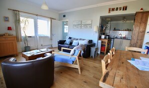 Kitchen just off the living room, with the dining area conveniently close by.