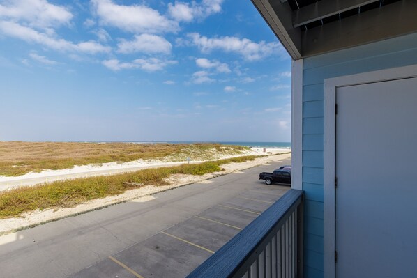 Private balcony off living area with beach views
