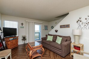 Plenty of natural light shining into the living area with full size sleeper sofa