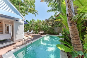 The pool house is steps away from the pristine private pool.