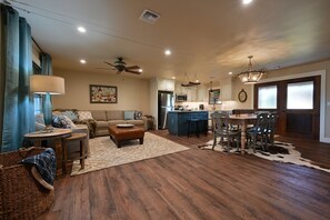 Open floor plan with dining, kitchen and living area.