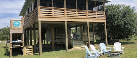 Canal front yard with fire pit and seating 