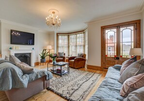 First floor sitting room with feature fireplace