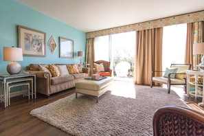 Family Room with 1 of the 2 balconies and morning sun!
