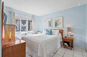 Primary Bedroom With Queen Bed and Bathroom