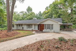 Front of the house with long circular driveway