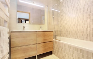 This apartment comes equipped with a full bathroom with either a walk-in shower or a shower-tub combination