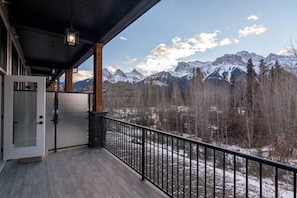 mountain view living room with balcony and patio
