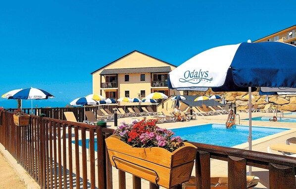 Relax by the outdoor pool in the summer