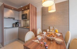 Enjoy meals and entertain together at the large dining table.