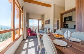 Entertain at the dining room table. The lay out of the suite may vary slightly from the photos.