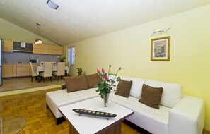 Apartment has a very equipped spacious living room.