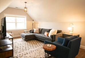 Living room with ample seating, Smart TV and wonderful views~The Rooftop