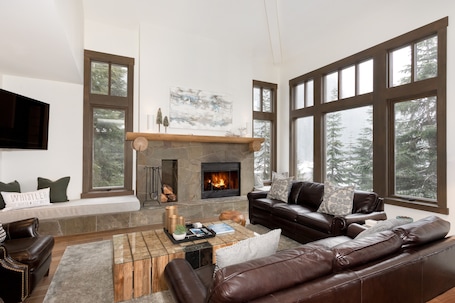 Spacious living area with TV and fireplace