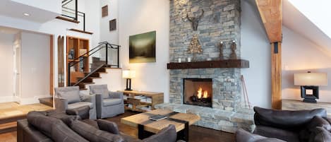 Spacious living area with fireplace and vaulted ceilings