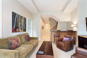 Second living area on lower level with TV and wet bar