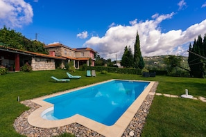 House, gardens, exclusive swimming pool.