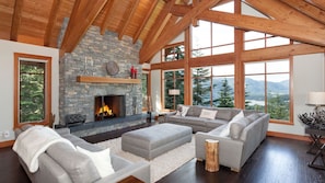 Spacious living room with vaulted ceilings and scenic views