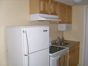 FULLY COMPLETE KITCHEN WITH CERAMIC COOKTOP STOVE, MICROWAVE AND ETC