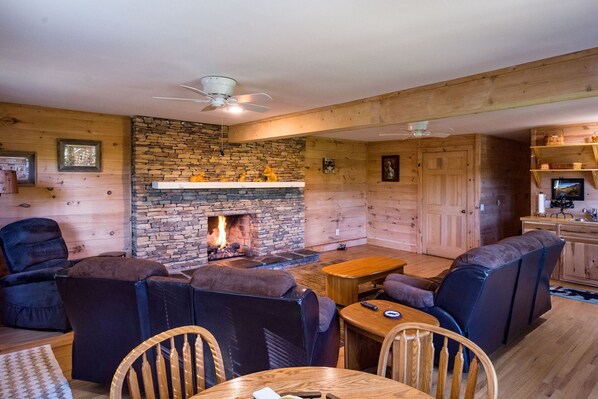 Beautiful Stone fireplace, 60" TV has been added  on a swivel stand