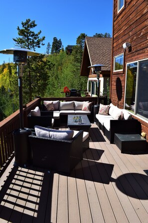 Upper deck w/ abundant seating, fire table and propane heater