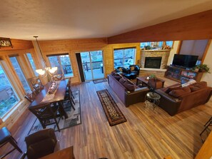 Full view of dining area, living room, remote work area & upper deck