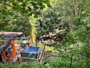 Riverside Hideaway is a secluded two bedroom lodge with hot tub close to Lynton.