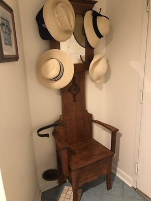 Grab a hat for the beach from the vintage hall tree.