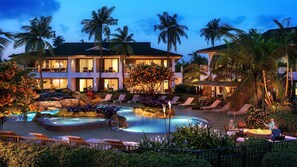 Artistic rendering of a Luana villa exterior at night with private pool.