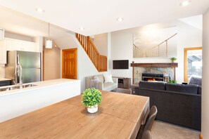Open plan living, kitchen, and dining spaces
