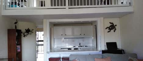 Looking up from the living room to upstairs loft bedroom/family room