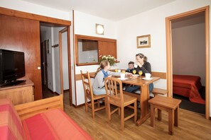 Enjoy your meals around the dining table with enough seating for everyone