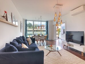 Funchal's stunning city apartment gem. #smart TV #AC #air conditioning # sofa #dining table