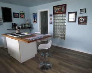 Butcher Block Island with stove top range.