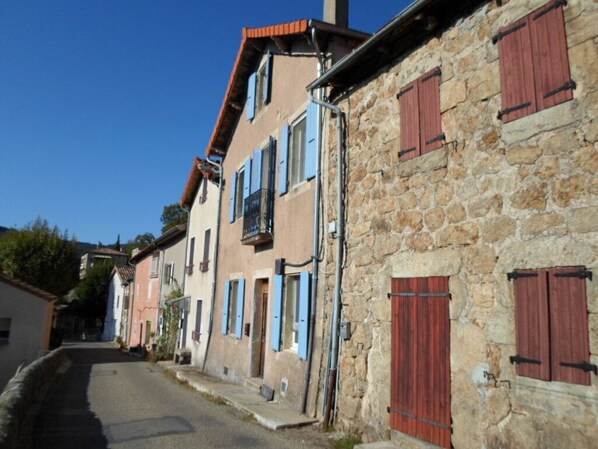 Our house with blue shutters and Juliet balcony.