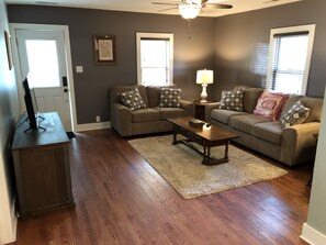 Living room with comfy sofas and tv with firestick