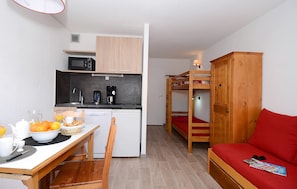 The cozy sleeping alcove features a bunk bed.