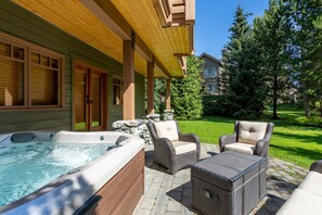 Private hot tub, patio, and inviting backyard